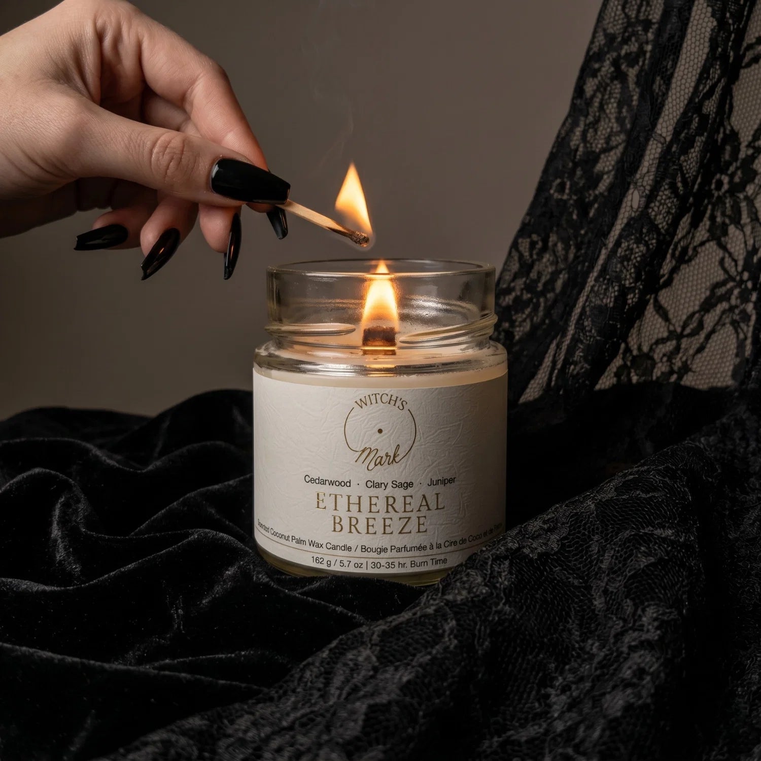 Hand lighting Ethereal Breeze crystal candle